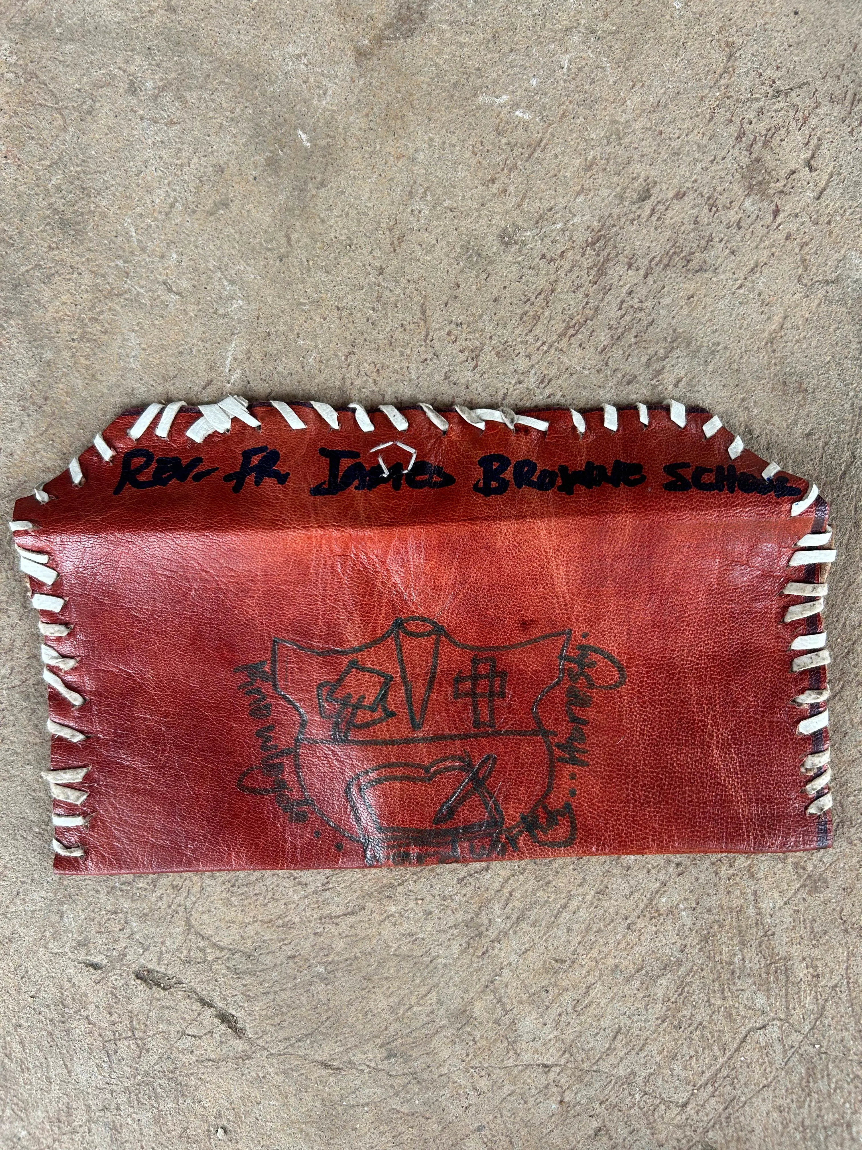 Leather pouches given to St. Luke students by James Browne Memorial students